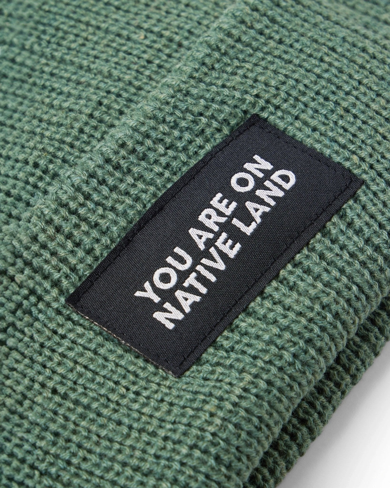 'YOU ARE ON NATIVE LAND' RIBBED BEANIE by Urban Native Era
