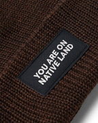 'YOU ARE ON NATIVE LAND' RIBBED BEANIE by Urban Native Era