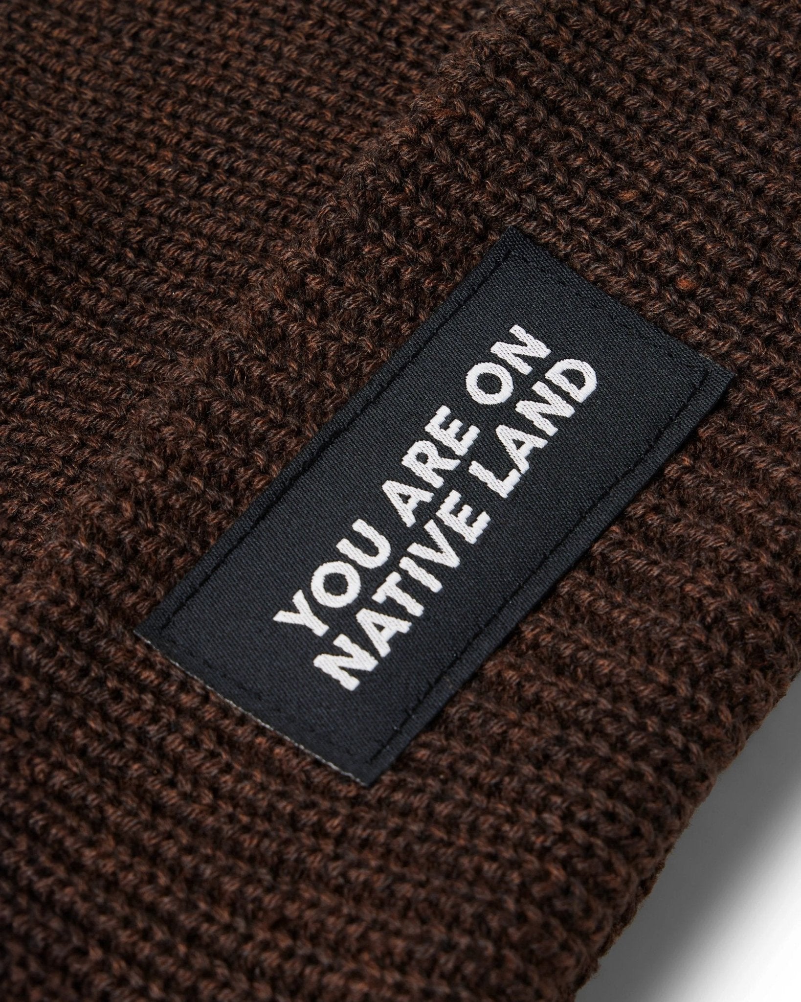 'YOU ARE ON NATIVE LAND' RIBBED BEANIE by Urban Native Era